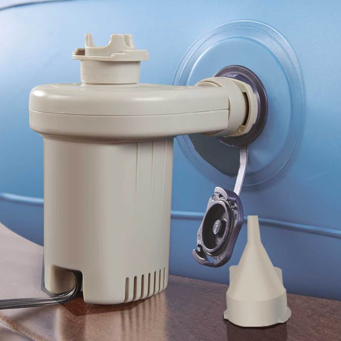 Beige pump attached to a blue container with a funnel on a wooden surface.