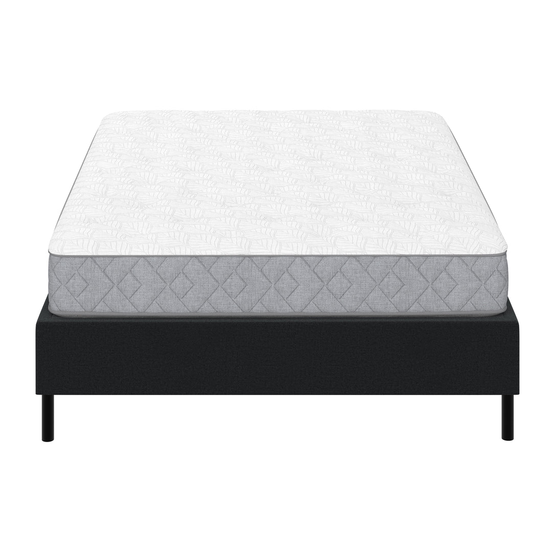 white mattress on metal platform bed frame with black cover