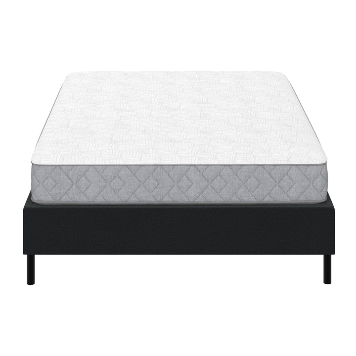 white mattress on metal platform bed frame with black cover