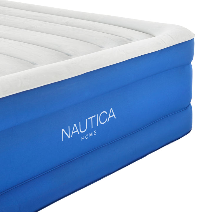 Blue inflatable mattress with white top and &