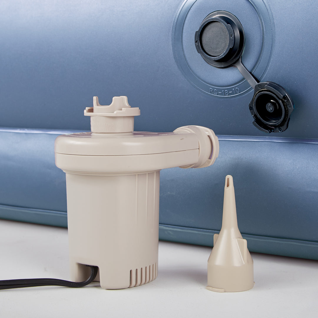 Beige pump attached to a blue cylindrical object on a white background