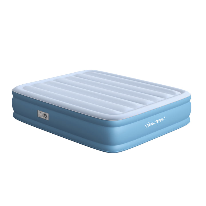 Blue inflatable mattress with white top on a white background