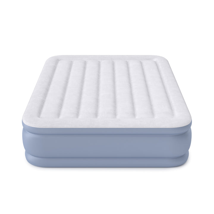 Inflatable air mattress with a white top and blue sides on a white background